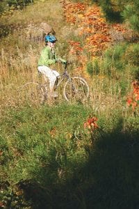 It was a glorious day for a bike ride on Saturday, Sept. 29, and this smiling rider was one of over 50 people to try out the new single-track mountain biking trails at Britton Peak. Bicyclists that took in all three loops pedaled more than 5 miles and were awed by the vistas and beautiful boreal forest they rode through.