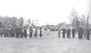 This old photo shows the Grand Marais High School Band performing for what appears to be a veterans event. Do any of the Viking band members remember this performance?