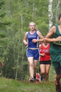 Left: Meadow Adams ran a great race at Swain, finishing with a time of 20:10. Meadow is a senior who is new to cross country, but she is improving steadily throughout the season. Above left: Assistant cross-country coach Chris Hegg calls Collin Berglund the hardest working runner on the team. Above right: Owen Cruikshank is a sprinter in track who loves to test himself by running cross-country. Owen ran 22:13 on the extremely hilly Swain cross-country course, a good time even for non-sprinters.