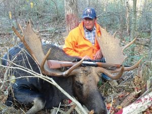 Ernie Deschampe of Grand Portage with the huge bull moose he got while hunting with Ron Anderson and Stuart Oberg, also of Grand Portage, on Saturday, October 6. The moose’s rack measured 58 ¼ inches and it is estimated that the bull weighed 1,000 pounds. The men were hunting in the Jackson Lake area. Oberg said they spotted the massive moose about 100 feet away in a clear cut and his first thought was, “No way do I see a bull that big, no way!” Deschampe took the shot with his 30-06 rifle.