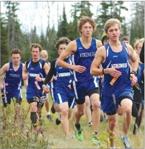 Far left: The boys ran together for awhile at the Polar League championships held at Pincushion before Ben Seaton (leading) pulled away to finish 7th and earn all-conference honors. Behind Ben are Nate Carlson, Will Seaton, Drew Christiansen, and Everett Holmes. Left: Mara MacDonell is one of the Vikings' most exuberant, dedicated runners. She placed 4th in the JV race at conference. Above: Morgan Weyrens-Welch had a good race at Pincushion, placing 15th in the girls varsity race.