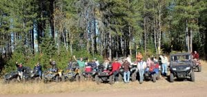 The last official ride of the year for the Cook County ATV Club was Saturday, September 29 in Lake County. Top: Twenty-plus people, 19 machines and four dogs took part in the ride that traveled to Comfort Lake in the area burned by the 2011 Pagami Creek wildfire. Above: Bill and Jean Cherwin of Devil Track Lake enjoyed the ride in their side-by-side ATV. Left: There was also a stop at the lovely little Section 29 Lake. Staff photos/Rhonda Silence