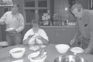 The Grand Portage Community Center Halloween Carnival included some amazingly decorated cakes, thanks to Grand Portage Elders. Here, Jon Sage, Polly James and Bob Hertzberg decorate some of the cakes.