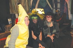 Upstairs at Betsy Bowen’s Studio was a spooky place on Friday, October 26 as the “Save the Mural” committee hosted a Halloween party and fundraiser. Above: A banana and witches—oh my! Left: Goofy Geishas greeted guests to the party. Far right: Werewolves of Grand Marais were on hand for the scary storytelling.