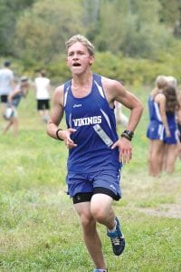 Left: Ben Seaton ran his best race of the season at the Section 7 cross country meet. Seaton placed 21st in a field of 123 runners and missed going to state by 18 seconds. Above: Freshman Pete Summers was the third varsity runner for the Vikings at sections. Pete steadily improved throughout the season and will be counted on for big things next fall.