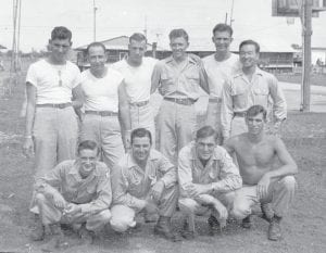 Above: Leonard Sobanja with a group of friends at his post near Manila in the Philippines. Sobanja is the young man on the right with no shirt on. He swam nearly every day while stationed there and entered the “South Pacific Olympics.” Right: Leonard Sobanja with one of the Army vehicles he used during his tour of duty. Sobanja had a wide variety of jobs during his time in the Philippines.