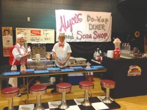 In keeping with the 1950s theme of the current Grand Marais Playhouse and School District 166 production, Doo-Wop Wed Widing Hood, the lobby has been transformed into a soda fountain, courtesy of Rebecca Thompson of Alyce’s.