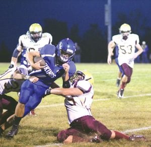 Far left: Viking quarterback Kale Boomer broke through both of these would-be tacklers to gain 8 yards on this play against Barnum. Boomer had an outstanding year for the Vikings and was named Polar League Offensive Player of the Year by coaches (More on that next week).