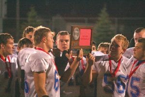 Above: Viking players hold up their runner-up Section 7A trophy after losing to a very good Barnum team.