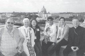 Marie Spry of Grand Portage was among a group of Native Americans from the Duluth Diocese who traveled to Rome to attend the canonization of Saint Kateri Tekakwitha. The group is pictured here on the roof of the North American College where seminarians from the United States attend classes. (L-R) Sonny Peacock from Fond Du Lac, Sister Marie Rose Messingschager from the Dioceses of Duluth, Claudia Lyytinen of Ball Club, Marie Spry, Alicia Cyr of Duluth and Bishop Sirba.