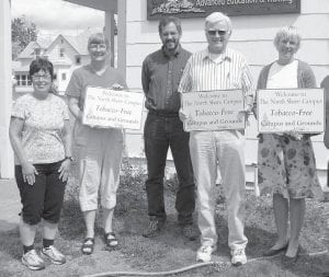 Members of the Cook County Higher Ed board were delighted to put up the tobacco free signs at the North Shore campus two years ago. (L-R) Beth Rogers Kennedy, Janet Ditmanson, Bill Hansen, Bob Pratt and Higher Ed Director Paula Sundet-Wolf. Jodi L. Tervo, program manager with the American Lung Association, said since then 13 additional campuses in Minnesota have passed similar tobacco-free policies.