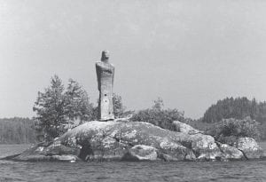 Bob Olson of the Gunflint Trail brought this photo of “Lady of Brule Lake” into the Cook County Historical Society Museum. Bob took this photo on August 27, 1984. He recalls being impressed when he paddled by the large figure in the late 1960s. When he returned with his family in 1984, he was surprised by how much the statue had weathered. Since that time the statue has disappeared, but curiosity remains. Who built the “lady”? Who erected her on an island in Brule Lake? Bob has asked many people and theories range from the lady being constructed by members of the Civilian Conservation Corps to a private resort. Bob remembers that the statue appeared to be hollow, but was still heavy. Does anyone know who made the statue and how tall it actually was? And what happened to her? Bob Olson, museum volunteers and others would like to know the story. If you know, please contact Museum Director Carrie McHugh at (218) 387-2883 or history@boreal.org.