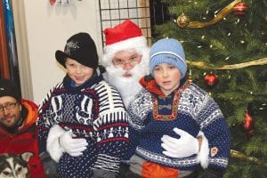 In keeping with the “Oh Ole Night” theme of the Grand Marais Chamber Holiday celebration, these young men donned dapper Scandinavian sweaters. They were among the dozens of kids who visited with Santa Claus at Stone Harbor Wilderness Supply after the Christmas parade. See more holiday fun on page A13.