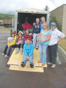 Packing up for their Scouting adventure were (L-R, front) Alicia Smith, Molly Sietsema, Leader Sandy Stover. (L-R, back) Brooke Sherer, Julia Larsen, Hannah Toftey, Sarah Toftey, Emily Jacobsen. (Not pictured Molly Thomas and Leader Helen Carter.)