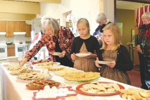 Irene Peterson and her granddaughters enjoyed Julefest, although picking just a few samples of the Scandinavian treats on hand was difficult.