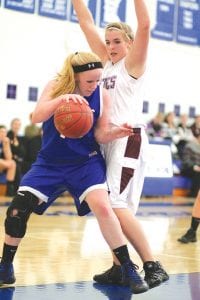 Left: Although she was guarded closely, Kaitlynn Linnell dribbled around her defender and scored two points from the paint. Kaitlynn was named Vikings' defensive player of the game for her play against Two Harbors. Above left: Up, up and away! Leaping like Super Girl, Leah Utities, No. 4 landed on the dark side of the moon after making this two-point jump shot against Two Harbors. Above right: Shooting wasn’t much of an option, so Jami Sjogren looked to pass the ball on this play. Jami scored 3 points against the Two Harbors Agates.