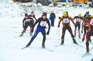 Although there hasn’t been much snow to train on, the Viking girls' and boys' cross country ski teams have been able to find enough white stuff to get in two ski races. Above, wearing bib No. 7, junior Joey Chmelik led the boys' team with a 26th place finish at the Ely Nordic Wolves Invite that had to be held in Duluth because of a lack of snow in Ely.