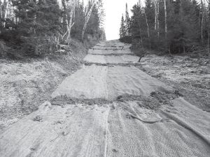 Projects completed since the formation of the Poplar River Management Board (PRMB), which represents property owners along the lower Poplar River, are estimated to have reduced sediment in the river by 30-40 percent. The PRMB, formed in 2005 after the river was listed as impaired due to sediment in the water, is working with the Minnesota Pollution Control Agency (MPCA) to use scientific research to figure out the most effective steps to be taken from here. (Above) The most recent project was the Ullr Tightline, which involved installing a pipe to transfer water from a collection pool at the top down a large pipe, where the water’s force is dissipated before emptying into the river.