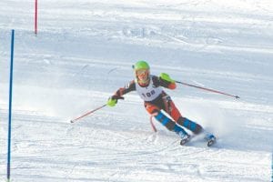 Above: Will Lamb bent the gate nearly in half as he raced his way down the slalom course at Giants Ridge on Friday, January 3. Will led the Vikings to a second place at the conference meet with his 8th place finish.