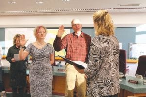 Heidi Doo-Kirk and Garry Gamble took their oaths of office as Cook County commissioners with Court Administration Lead Worker Kim Shepard at the beginning of the January 8 county board meeting. Doo-Kirk is replacing Jim Johnson in the Maple Hill/Gunflint district and Gamble is replacing Fritz Sobanja in the east Grand Marais district.