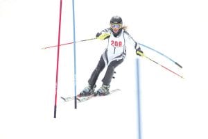 Left: Girls’ Alpine team captain Signe Larson took 1st place in the individual girls' races, looking right at home at Lutsen Mountains.