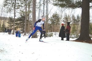 Cook County Nordic skiers had a great day at Pine Valley in Cloquet, skiing among red and white pines with 300 skiers from other schools. Above: Audrey Summers was one of the first racers up on January 8. She finished well on the extremely fast course. Above right: Will Seaton was up for the challenge. Right: Levi Axtell had a good race, powering his way to a 24th place finish.