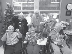 The North Shore Care Center is getting ready for a busy calendar of events in February. Residents are making valentines and decorations to deck the halls, doors, and windows. (L-R, front) Eleanor Matsis, Joyce Kehoe, Donna Willett. (L-R, back) Dorothe Vaughn, Don Ingram, Marie Jacobson.