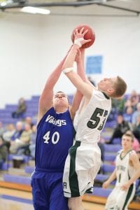 Playing stellar defense, Jonny Jacobsen blocked this shot by the Northeast Range player. The loveable lug is filling the center spot nicely and is back to playing full-time after being out for most of the season due to a knee injury.