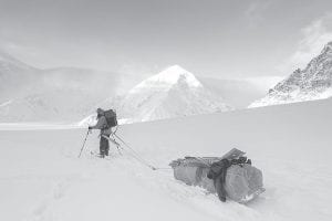 Lonnie Dupre, age 51, once again was scuttled by the weather in his third attempt to summit Mount Denali during the dead of winter. Here he is shown pulling his sled loaded with 150 pounds of gear while his backpack contains about 50 more pounds. Deep snow plagued him early and fierce cold and wind drove him down the mountain after he climbed to 17,200 feet.