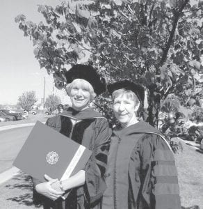 Paula Sundet Wolf, director of Cook County Higher Education, recently completed her doctoral program at the University of North Dakota. Sundet Wolf earned her Ph.D in teaching and learning. She is pictured here at commencement with her advisor Dr. Lynne Chalmers.