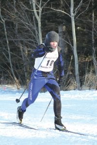 Left: Dressed for the cold, Levi Axtell powered his way to an 18th place finish to lead his teammates in the first race of the day at the Pincushion Invitational. Above left: Starting with a smile at the Pincushion Invitational was junior high racer Brenna Hay. Above middle: In her first race ever, Linnea Henrikson had a fine finish at Pincushion. Above right: Skiing with gusto, Lucy Callender seemed to enjoy the first cross country race she has ever competed in.