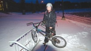 Noah Furcht of Grand Marais gets up bright and early every school day to head to school on his bicycle. Only on the most extreme weather days does he accept a ride. He is all smiles as he reaches school and parks his bike on a recent snowy day.