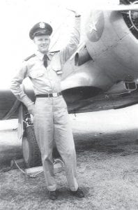 This photo shows the daring Lt. Raymond H. Palon Jr., 23 years old, next to one of the planes he flew.