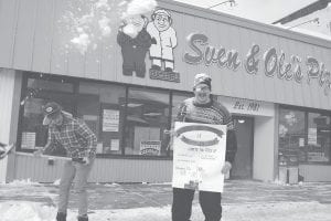 “Sven” madly shovels snow, most of it landing on “Ole’s” head. Ole obliviously holds up a sign advertising the Sven & Ole World Championship Joke telling contest that will be held Feb. 20 at Sven & Ole’s pizzeria in Grand Marais at 7 p.m. “Sven” and “Ole” are actually Anton Ligaarden and Kristian Balsrod, two Norwegian filmmakers and journalism students. They are hosting the joke telling contest.