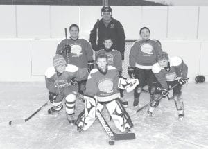 Left: The energetic M2 team has played its heart out this season. (L-R, front) CJ Luehring, Andrew Hallberg, Cy Oberholtzer. (L-R) Patrick Pierre, Ryan Christiansen, John Pierre. In the back is Coach Pat Pierre. (Not pictured Kole Anderson)