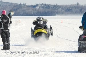 Drag Racing! The Cook County Ridge Riders Snowmobile Club hosted its second snowmobile drag race event on Hungry Jack Lake on Saturday, Feb. 16—and this time snow was abundant! Samantha Williams on the bullhorn watches as Tony Everson takes off.