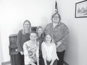 A wonderful piano recital was held at the North Shore Care Center recently, courtesy of piano teacher Laura Laky. (L-R, front) Hannah and Kate Muntean. (L-R, back) Abby and Alexa Muntean and instructor Laky.