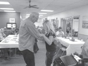 The Senior Center had a great Valentine’s Day party. Above: There was dancing! Bill Shaffer gives Ashley Green a polka lesson. Left: Tom Hedstrom celebrated by wearing his Mad Hatter hat.