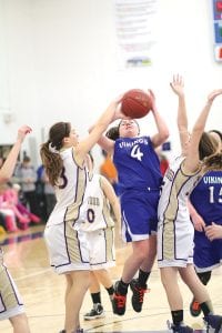 Where there’s a will there’s a way! Leah Utities busted through the defense to score two hard-earned points against the Floodwood Polar Bears in a recent game played at home. Utities scored 8 points against Two Harbors.