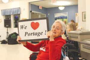 There was a celebration at the North Shore Care Center on February 23, in recognition of the popular local band Portage, which received an award from Aging Services of Minnesota for enhancing quality of life for seniors in our community with monthly dances at the Care Center. Eleanor Matsis shows her appreciation of the band