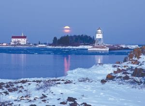 The full moon at the end of February was a photographer’s dream. Paul Sundberg of Grand Marais caught this image of not only the moon reflecting on the ice, but the Grand Marais lighthouse as well. Sundberg said he thought the clouds along the horizon were going to block the moon’s appearance; however, they actually enhanced the photo opportunity by creating a band that the moon had to pass through.