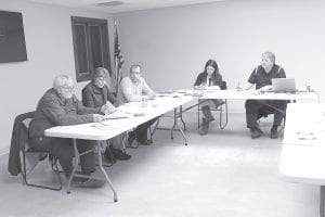 The Lutsen Town Board held its first meeting in the new town hall space on Tuesday, February 19, 2013. Getting used to the new meeting room were (L-R) Supervisors Marland Hansen, Ginny Storlie and Joe Buttweiler; Clerk Silviya Duclos and Treasurer John Groth.