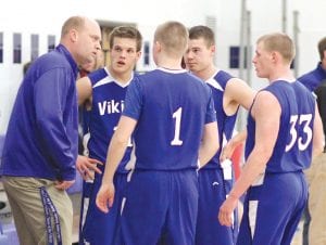 With his players looking focused, Viking Head Coach Mitch Dorr instructs his team during a timeout. Standing to Dorr’s left is Kale Boomer and next to Kale is Colin Everson. Lars Scannell (No. 1) is also pictured. Boomer and Everson were both recently named to the Polar League All-Conference team while Dorr was named one of the head coaches for the Polar League All-Star game.