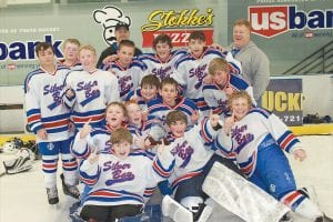 The Silver Bay-Cook County PeeWee Hockey team celebrates its win at the league championship at the Hermantown arena on February 24, 2013. After thousands of miles and hours of practice, the victory was sweet. Congratulations PeeWees!