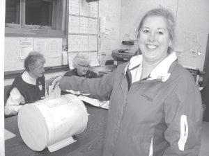 Tina McKeever casts her vote in the Schroeder Township Election on Tuesday, March 12, 2013. McKeever was re-elected for another term as supervisor.