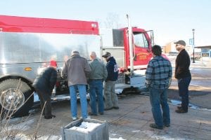 Grand Marais Fire Chief Ben Silence and lead firefighter Aaron Mielke visited city councilors at their March 13 meeting, and brought with them the fire department’s newest acquisition – a 2012 tender. A FEMA grant was used to pay 90 percent of the cost of the approximately $210,000 vehicle. The truck was manufactured by Stainless & Repair Inc. of Marshfield, Wis., holds 2,000 gallons of water and is equipped with a 750 gallon-per-minute pump. The tender replaces a 1984 converted milk truck, which was traded in. Chief Silence lauded Mielke’s dedication and perseverance for completing the many grant forms, putting together the specs and attending meetings that led to the city’s successful grant application. “I give him much credit for his time and effort,” said Silence. “It was an excellent job.” The tender joins a fleet that also includes a 2007 pumper, a 1978 50-foot ladder truck, a 1994 Ford support truck and a First Responders vehicle. The department, which includes firefighters and First Responders, is comprised of 22 members.