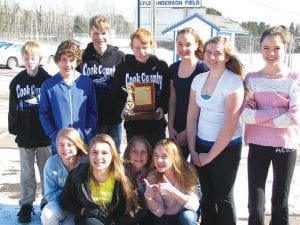 Above left: A special congratulations to the top finishing racers who brought home the championship trophy from the final Northland Junior Race Series at Spirit Mountain on March 3. (L-R, front) Sela Backstrom, Reilly Wahlers, Elsa Lunde, Claire LaVigne. (L-R, back) Caleb Phillips, Ezra Lunde, Will lamb, Damian Zimmer, Alyssa Martinson, Madysen McKeever, Santina McMillan. Above right: On the podium, Riley Tarver and Peter Robinson celebrate first and second place!