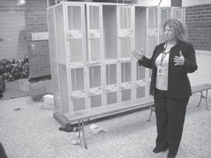 The latest School District 166 school board meeting included a tour of the demolition and construction under way for the new Cook County Family YMCA, attached to the Cook County Schools building. Superintendent Beth Schwarz explains the plans for locker rooms to the school board.