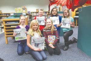 These Sawtooth Mountain Elementary School fifth-graders are aspiring writers. They have been giving up their lunch hour to learn about writing with mentor Pat Campanaro. Recently Cook County News- Herald Editor Rhonda Silence and Associate Editor Jane Howard had the interesting experience of talking to—and being interviewed by—the young writers. They are (L-R, front) Paige Everson, Emma Gesch. (L-R, back) Halle Lamb, Sam Sietsema, Madison Foster, Jaymie Kirk.