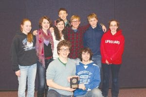 Above: Cook County High School fielded two teams at the regional Knowledge Bowl tournament on March 20. Team No. 1 captured the first place trophy and the two CCHS teams received special recognition for good sportsmanship. Pictured with the good sportsmanship award are (L-R, front) Will Seaton and Joey Chmelik. (L-R, back) Libby Zafft, Mara MacDonell, Sarah Larsen, Sean MacDonell, Ben Seaton, Sterling Anderson and Brenna Hay. Left: CCHS Team No. 1 celebrates its first place finish at the regional Knowledge Bowl tournament. The team is headed to the State Meet April 11 – 12, 2013. (L-R, front) Mara MacDonell, Sarah Larsen, Ben Seaton, Will Seaton. (Back) Sean MacDonell.